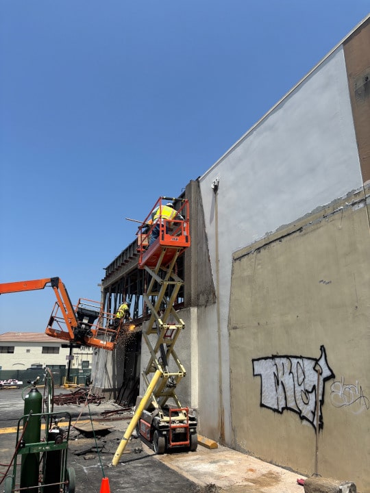 two scissor lifts during demolition of erewhon store in glendale ca