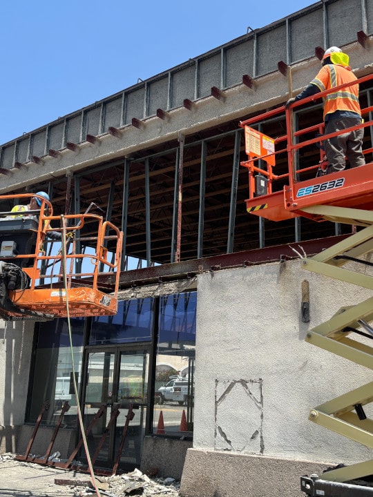 two scissor lifts during demolition of erewhon store in glendale ca