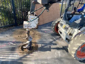close up of an auger bit mounted on bobcat
