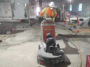 concrete floor grinder being used for takeda pharmaceuticals demolition project