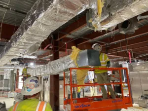manlift removing ducting for takeda pharmaceuticals demolition project