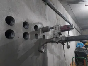 imt residential concrete coring with core drills attached to wall - pic 1