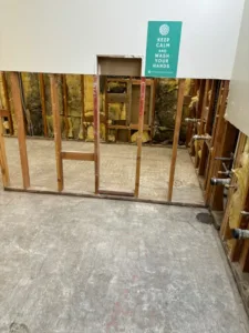 tile removal project at irmas campus school -bathroom view 1