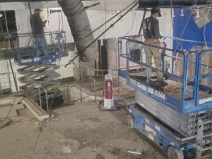 crew working on ceiling demolition