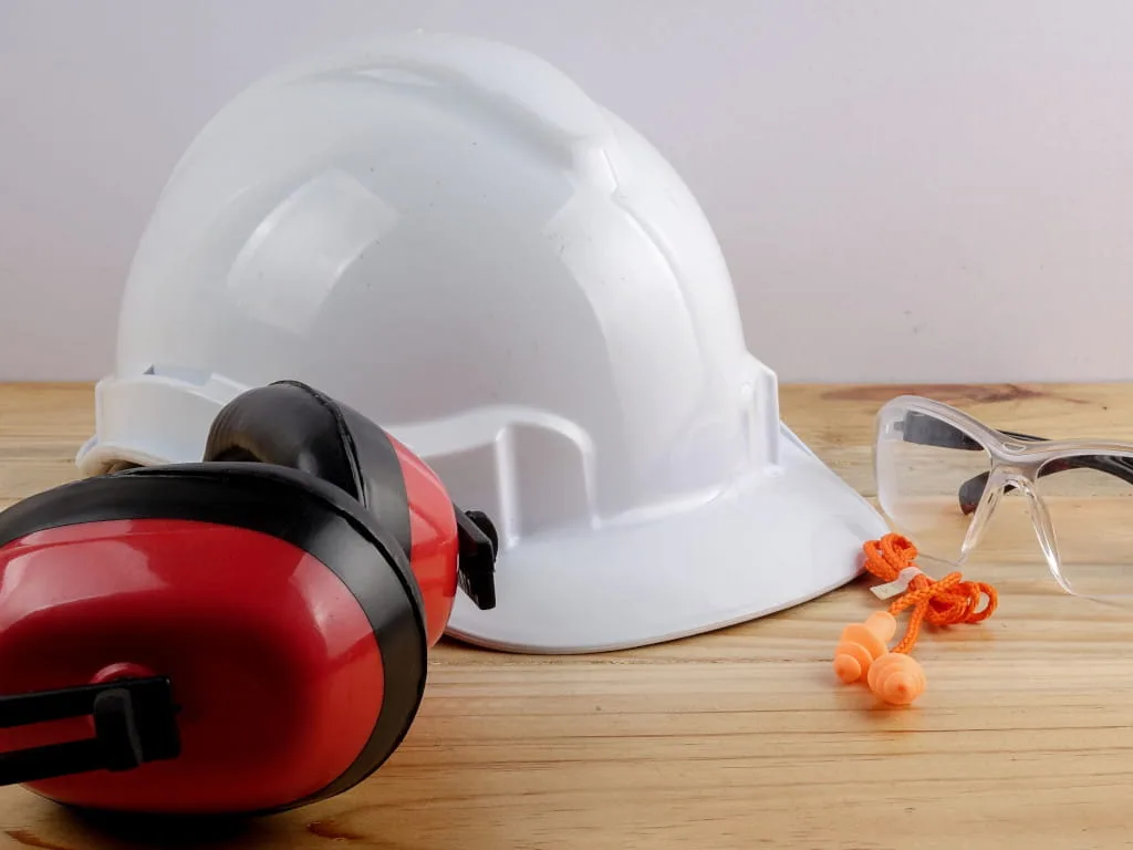 personal protection equipment picturing hard hat, earplugs, earmuffs, safety glasses