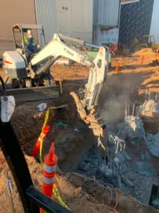 bobcat lifting concrete debris at northrop grumman