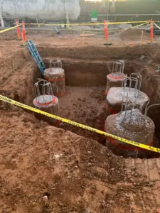 four concrete piles protruding vertically at northrop grumman demolition site