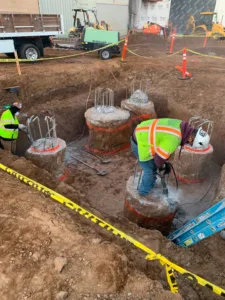 crew removing rebar from concrete piles at northrop grumman demolition site